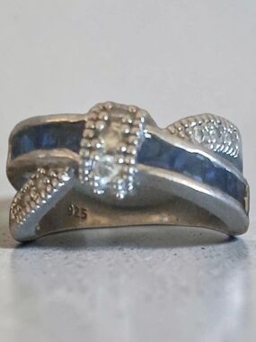 Sterling Silver Crossover Ring with Deep Blue Accents
